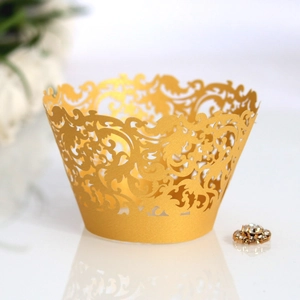 Laser cut hollow gold cupcake liners with elegant baroque lace patterns for wedding party decor