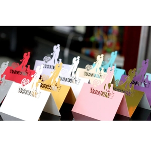 Laser-cut wedding heart table cards with hollow silhouette and WEDDING text design