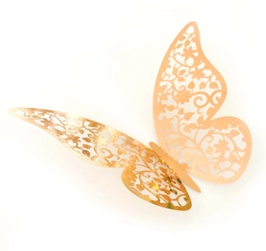 Detail of rose gold 3D hollow butterfly wall sticker with floral laser cut patterns