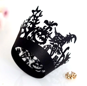 Laser-cut Halloween cupcake wrappers featuring spooky castle, bat and witch designs