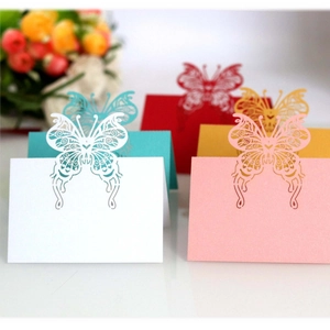 Golden butterfly laser-cut table name cards for wedding seating in various colors