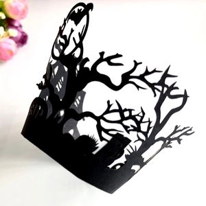 Laser-cut black Halloween cupcake wrappers with bats and graveyard design