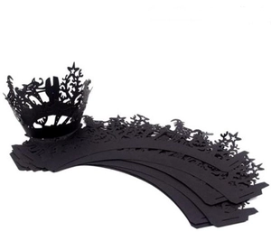 Laser-cut black Halloween cupcake wrappers with star cutouts and intricate spiderweb patterns