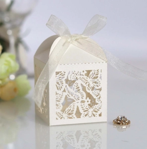 Elegant white laser-cut butterfly gift box with white organza ribbon for wedding favors