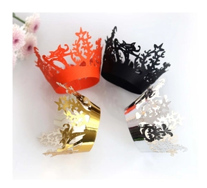 Laser-cut Halloween cupcake wrappers in orange, black, gold and silver with cat star patterns