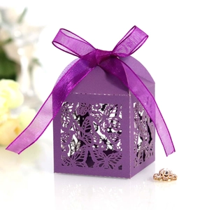 Purple laser-cut butterfly candy gift box with an elegant ribbon bow for weddings