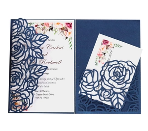 Laser cut navy blue floral wedding invitation set with elegant rose pattern sleeves