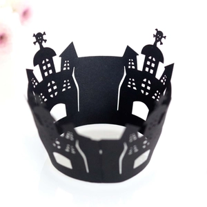 Halloween cupcake wrappers featuring laser-cut haunted castle and skull patterns