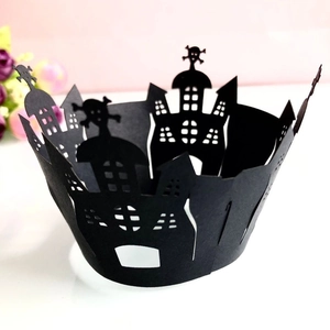 Laser cut Halloween cupcake wrapper featuring spooky castle and skull designs in matte black
