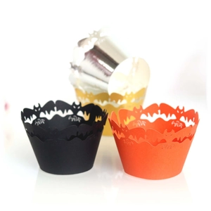 Laser cut Halloween cupcake wrappers featuring black and orange bat patterns for party decor