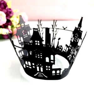 Laser-cut black Halloween cupcake wrapper featuring a detailed haunted house silhouette