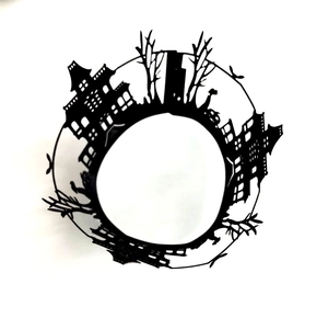 Laser-cut Halloween cupcake liners with black castle, bats, and spooky tree silhouette
