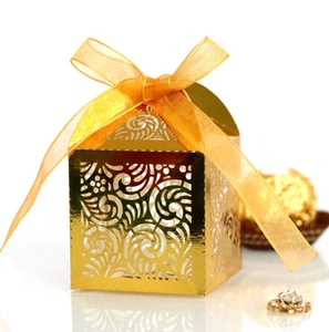Elegant gold laser cut candy box with ribbon for wedding party and holiday gifts
