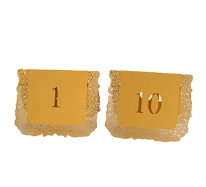 Champagne gold laser-cut lace wedding table numbers 1 and 10 on white background