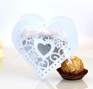 Laser-cut white heart favor box with ribbon for wedding sweets and chocolates