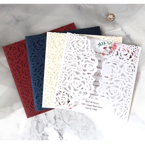 Laser-cut rose wedding invitations in burgundy, navy, cream and white cardstock