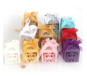 European laser-cut pumpkin carriage wedding candy boxes in assorted colors with ribbons
