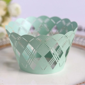 Mint green laser-cut muffin cup wrappers with elegant diamond hollow pattern