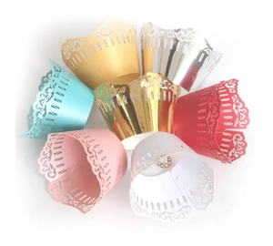 Laser cut lace cupcake wrappers in multiple colors for decorative dessert presentation