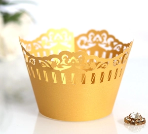 Golden laser cut lace cupcake wrappers with baroque hollow design for elegant dessert display