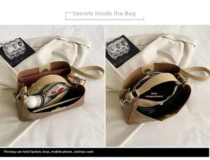 Detail view of the spacious main pocket in a brown bucket bag with daily essentials inside