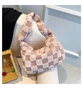 Close-up of pink and beige checkerboard plush tote bag with soft fluffy texture