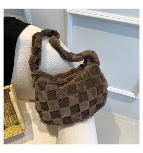 Detail of soft plush checkerboard shoulder bag showing fuzzy texture in brown and beige