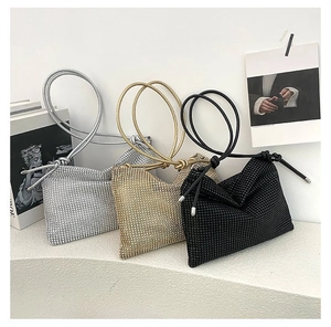 Detailed view of sparkly rhinestone crossbody bags in silver gold and black finishes