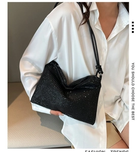 Close-up of black rhinestone mesh shoulder bag featuring a rectangular flat structure