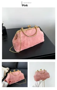 Detail of pink faux fur handbag with golden metal frame and vintage ball clasp closure
