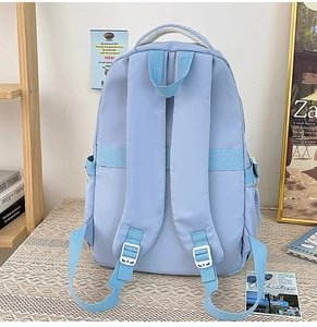 Detail view of water-resistant nylon backpack with breathable mesh handle and straps