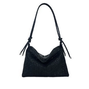 Detail of black rhinestone shoulder bag featuring sparkling crystals and soft hobo structure