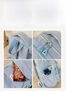 Detail view of light blue nylon backpack features sturdy handle and side water bottle pocket