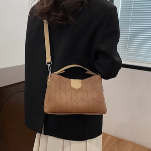 Retro brown quilted faux leather handbag with V-stitch design and crossbody strap