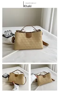 Detail of khaki PU leather bag featuring geometric cube texture and brown handle straps