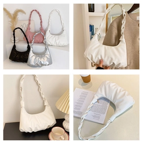 Detail showing pleated cloud bag texture and chunky braided handle in four colors