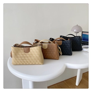 Detailed view of large tote bags in four colors with 3D geometric embossed texture