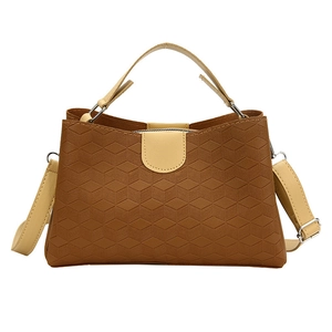 Caramel brown geometric quilted tote bag with cream straps and silver hardware detailing