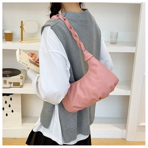Pink crescent hobo bag with pleated texture and stylish knotted woven shoulder strap detail