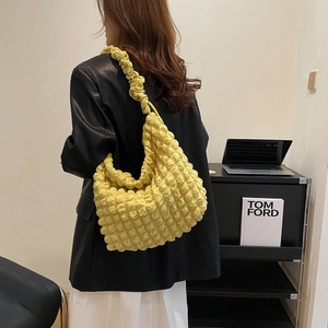 Large bright yellow popcorn texture tote bag for women showing stylish slouchy shoulder style