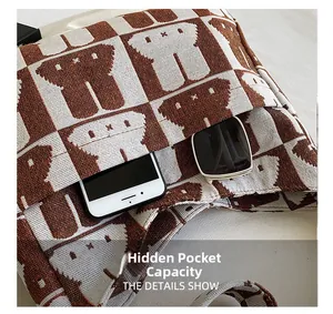 Detail view of the interior zip pocket and lining of the rabbit knit tote bag