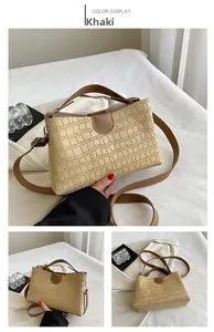 Détails du sac cabas kaki avec texture crocodile et fermeture magnétique en gros plan