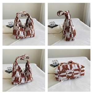 Detailed views of checkered knit tote bag with rabbit pattern and thick fabric texture