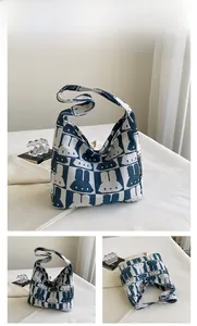 Detailed knit texture of the blue bunny pattern tote bag with wide shoulder strap