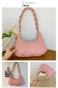 Pink cloud-style pleated shoulder bag featuring a woven strap and soft faux leather finish