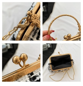Detail of black and white tweed crossbody bag with golden clasp and metal chain strap