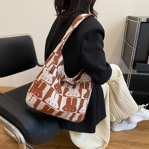 Knitted tote bag with brown and beige rabbit pattern for casual autumn style