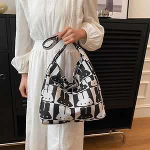 Knitted rabbit pattern tote bag in black and white minimalist pixel style for women