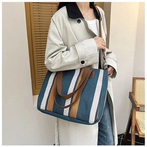French vintage canvas tote bag with blue and yellow stripes shown on model