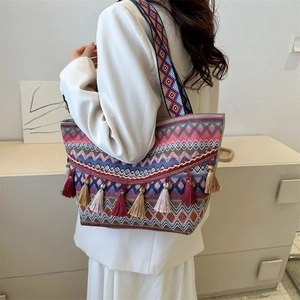 Ethnic style large capacity tote bag with bohemian tassels and colorful woven textures